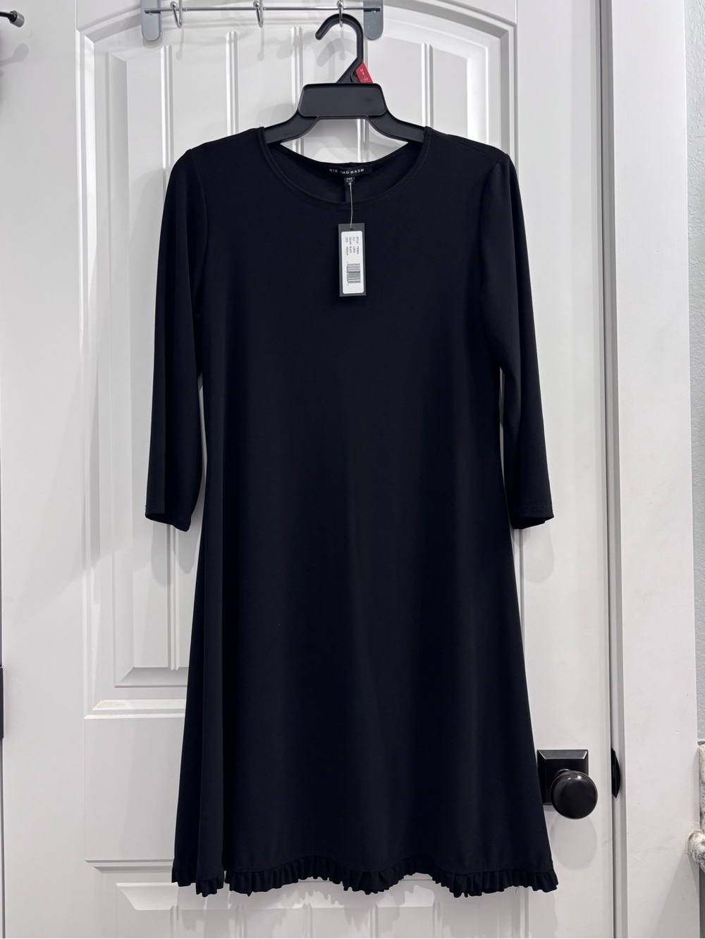 Nik and Nash Black Crewneck Dress with Ruffle Bottom Hem